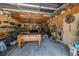 Rustic garage featuring a foosball table, pegboard, and overhead lighting at 910 E North Bay St, Tampa, FL 33603