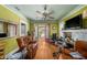 Bright living room with hardwood floors, classic trim, and comfortable leather seating at 910 E North Bay St, Tampa, FL 33603