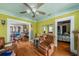 Cozy living area showcases hardwood floors, decorative trim, and open access to other rooms at 910 E North Bay St, Tampa, FL 33603