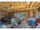 Spacious room with exposed ceiling joists and a workbench area at 910 E North Bay St, Tampa, FL 33603