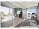Balcony view into bedroom featuring neutral colors and sliding glass door entry at 911 Harbour House Dr, Indian Rocks Beach, FL 33785