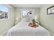 Bright bedroom with a large bed, crisp white linens, and windows with views of the neighborhood at 911 Harbour House Dr, Indian Rocks Beach, FL 33785
