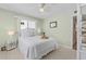 Serene bedroom with a comfortable bed and scenic outdoor views from two large windows at 911 Harbour House Dr, Indian Rocks Beach, FL 33785