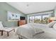 The main bedroom is spacious and bright, featuring a TV and sliding doors to a balcony at 911 Harbour House Dr, Indian Rocks Beach, FL 33785