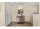 Inviting foyer with elegant decor, a mirrored cabinet, and wood-look flooring at 911 Harbour House Dr, Indian Rocks Beach, FL 33785