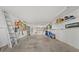 A well-lit garage with ample space, featuring storage solutions and room for vehicles at 911 Harbour House Dr, Indian Rocks Beach, FL 33785