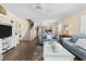 Inviting living room featuring modern decor, staircase, and an open floor plan at 911 Harbour House Dr, Indian Rocks Beach, FL 33785