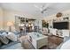 Inviting living room with hardwood floors, comfortable seating, ceiling fan, and access to a charming outdoor balcony at 911 Harbour House Dr, Indian Rocks Beach, FL 33785