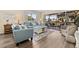Comfortable living room with stylish sofas, a modern coffee table, and sliding door access to balcony at 911 Harbour House Dr, Indian Rocks Beach, FL 33785
