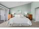 The main bedroom is spacious and bright, with doors to the balcony and a neutral color palette at 911 Harbour House Dr, Indian Rocks Beach, FL 33785