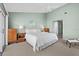 The main bedroom is spacious and bright, with doors to the balcony and access to the ensuite at 911 Harbour House Dr, Indian Rocks Beach, FL 33785