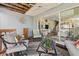 Cozy outdoor patio with comfortable seating, stylish decor, and seamless indoor-outdoor flow with sliding glass doors at 911 Harbour House Dr, Indian Rocks Beach, FL 33785