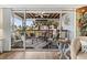 Relaxing outdoor patio with comfortable seating and views of lush landscaping at 911 Harbour House Dr, Indian Rocks Beach, FL 33785