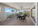 Balcony with outdoor dining table and chairs offers views of the intercoastal waterway at 931 Inlet Cir, Venice, FL 34285
