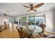 Bright dining area with waterfront views from sliding glass doors to the outdoor deck at 931 Inlet Cir, Venice, FL 34285