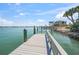 Beautiful deep water dock with power, water, and lights, just steps away from the back patio at 931 Inlet Cir, Venice, FL 34285