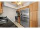 The well-equipped kitchen includes stainless steel appliances, granite countertops, and custom wood cabinets at 931 Inlet Cir, Venice, FL 34285