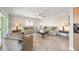 Living room featuring neutral color palette, tile flooring and a ceiling fan at 931 Inlet Cir, Venice, FL 34285