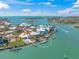 Aerial view of waterfront homes featuring boat docks and panoramic ocean views at 931 Inlet Cir, Venice, FL 34285