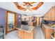 Bright kitchen featuring stainless steel appliances, granite countertops, and a wooden island with stainless countertop at 9718 Lomalinda Ct, New Port Richey, FL 34655