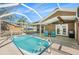Backyard pool with screened enclosure at 9718 Lomalinda Ct, New Port Richey, FL 34655