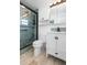 Stylish bathroom features a tiled walk-in shower with a rainfall showerhead and modern fixtures at 109 Carmelina St, Ruskin, FL 33570