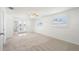 Bright bedroom with carpet, natural light and access to an outdoor patio at 109 Carmelina St, Ruskin, FL 33570
