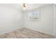 Bright bedroom with white walls, light-colored marble flooring, and a ceiling fan at 109 Carmelina St, Ruskin, FL 33570