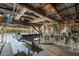Covered boat lift with storage for equipment and a boat ready for a cruise at 109 Carmelina St, Ruskin, FL 33570
