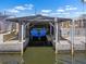 Boat in a covered boat slip with working lift capabilities for boat storage at 109 Carmelina St, Ruskin, FL 33570