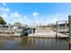 Waterfront property features a large dock area and boat lift for easy access to the water at 109 Carmelina St, Ruskin, FL 33570
