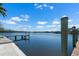Relaxing view from the dock of the calm river and green scenery under a sunny sky at 109 Carmelina St, Ruskin, FL 33570