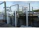 Boats on a lift on dock featuring green wood pillars and calm river waters at 109 Carmelina St, Ruskin, FL 33570