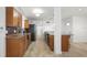 Modern kitchen with wood cabinets, tile floors, stainless steel appliances, and granite counters at 109 Carmelina St, Ruskin, FL 33570