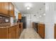 View of the kitchen with wood cabinets, granite countertops, and stainless appliances at 109 Carmelina St, Ruskin, FL 33570