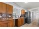 Kitchen with granite countertops, wooden cabinets and stainless refrigerator at 109 Carmelina St, Ruskin, FL 33570