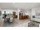 Bright, open-plan living space with kitchen, dining area, and modern decor and fireplace at 109 Carmelina St, Ruskin, FL 33570