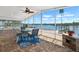 Enclosed patio boasting brick flooring, views of the waterfront, and a ceiling fan at 109 Carmelina St, Ruskin, FL 33570