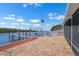 Brick patio with views of the water and a boat dock at 109 Carmelina St, Ruskin, FL 33570