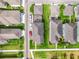 An aerial view of the houses with manicured lawns, paved driveways, and lush greenery at 11109 Great Neck Rd, Riverview, FL 33578