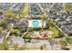 Aerial view of the community pool, clubhouse, playground, and surrounding neighborhood at 11109 Great Neck Rd, Riverview, FL 33578
