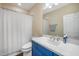 Bathroom with blue cabinets and white countertops at 11109 Great Neck Rd, Riverview, FL 33578