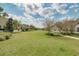 Large, well-maintained community green space with a gazebo and walking path for residents at 11109 Great Neck Rd, Riverview, FL 33578