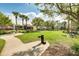 Relaxing community park with lush green spaces, picnic tables, water fountain, and convenient walking path at 11109 Great Neck Rd, Riverview, FL 33578