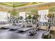 Modern treadmills and elliptical machines in a well-lit exercise area at 11109 Great Neck Rd, Riverview, FL 33578