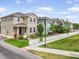 Street view of attractive two-story home with manicured lawn, white fence, and colorful landscaping at 11109 Great Neck Rd, Riverview, FL 33578