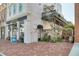 Charming building with a liquors store, a tranquil fountain, and an ivy-covered gate at 11109 Great Neck Rd, Riverview, FL 33578