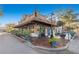 Stunning brick building with outdoor seating, a fountain, and lush planters, perfect for a relaxing atmosphere at 11109 Great Neck Rd, Riverview, FL 33578