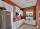 Kitchenette with stainless steel appliances and ample counter space near the pool area at 11109 Great Neck Rd, Riverview, FL 33578