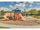 Community playground features multiple play structures, slides, and a picnic shelter at 11109 Great Neck Rd, Riverview, FL 33578